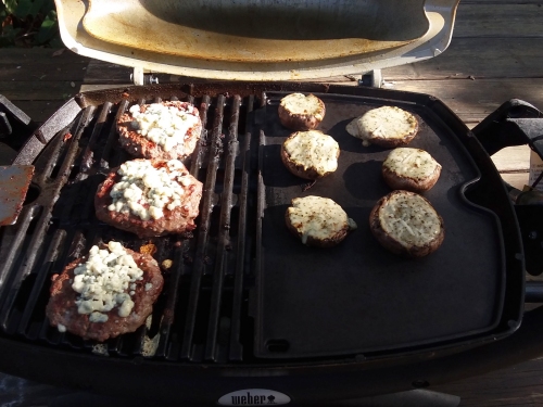 Grilling burgers and stuffed mushrooms.