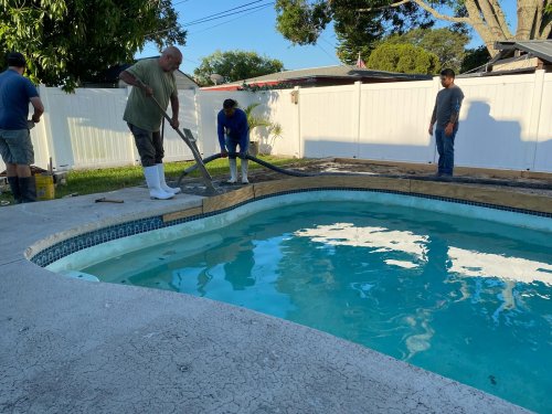 Pouring concrete for the new pool deck.