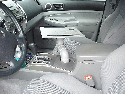 The painted laptop tray installed in the truck