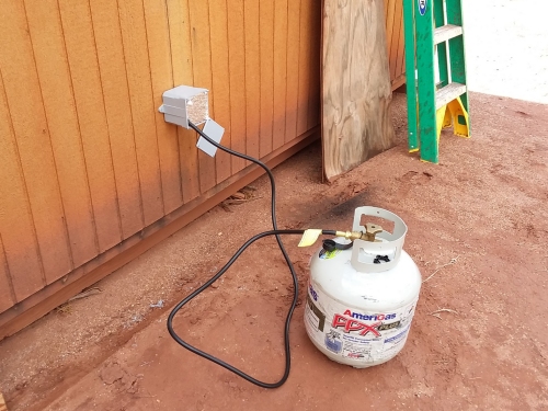 The outside propane tank for the heater.