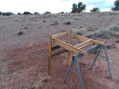 Sifting gravel.