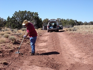 Me filling potholes in the road