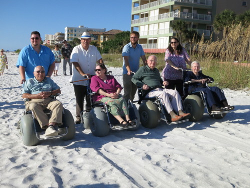 Four beach wheelchairs.